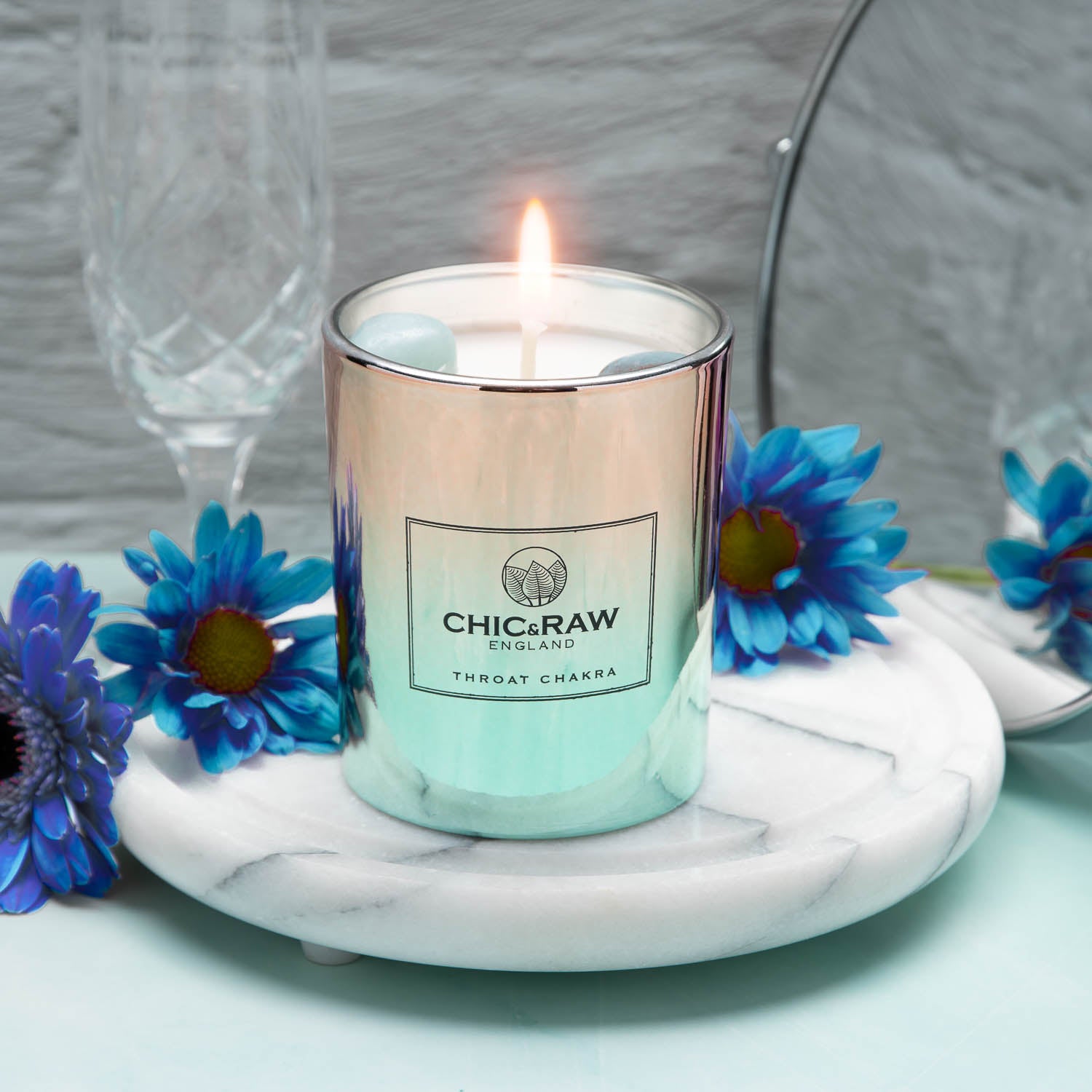 Aquamarine Crystal candle lit with blue flowers