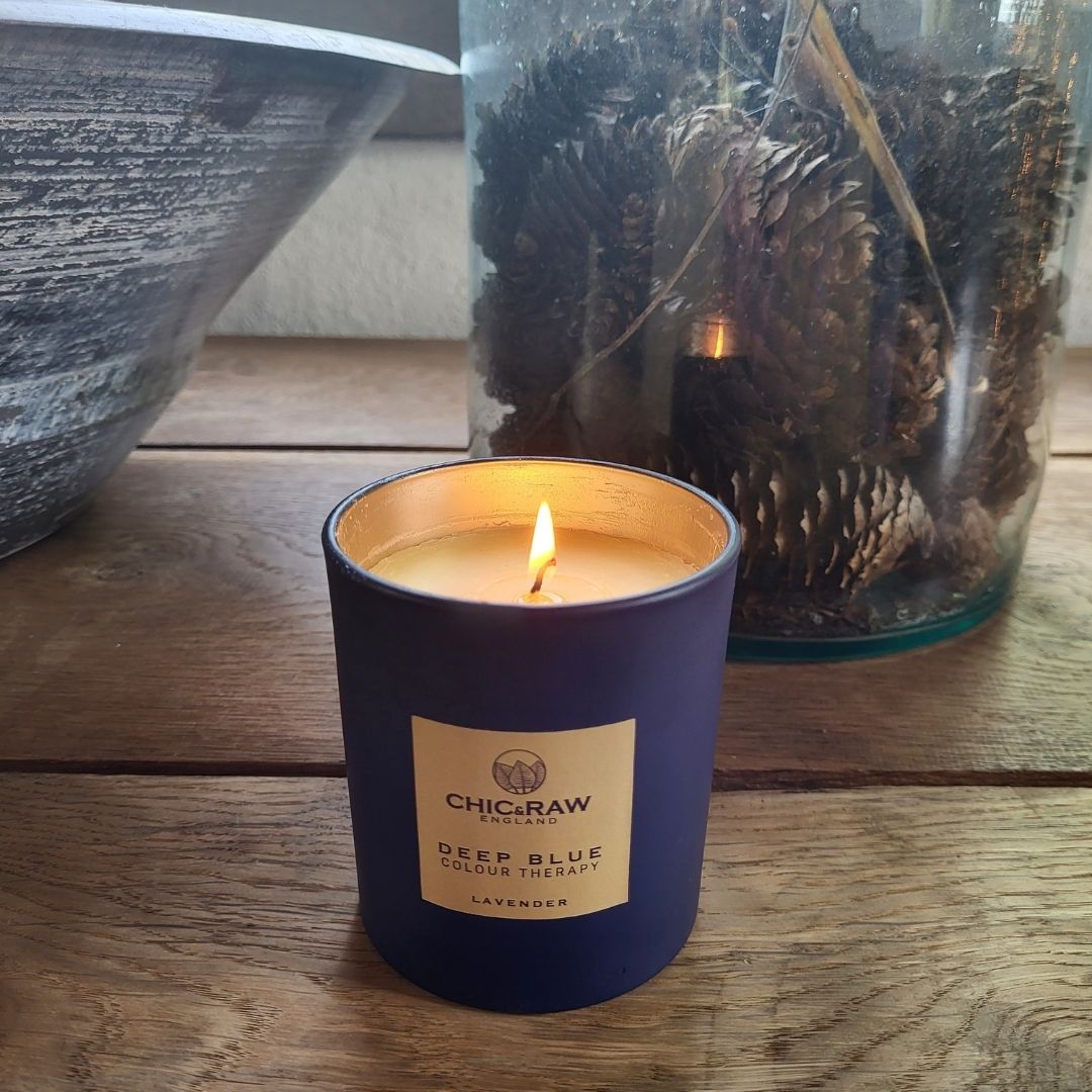 Deep blue candle lit, calming aroma, color therapy benefits